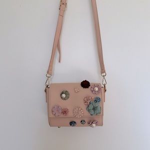 Light pink embellished crossbody purse with adjustable strap